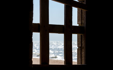 sea view from old wooden window