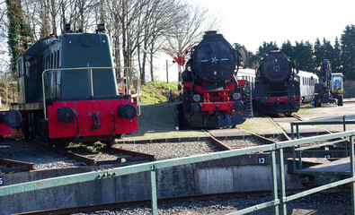 Three old steam locomotives face a railroad turntable at the old station of Beekbergen, the Netherlands