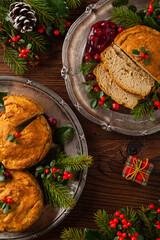 Small, baked patties in Christmas retro styling. Top view. Natural wooden background.