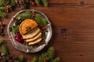 Small, baked patties in Christmas retro styling. Top view. Natural wooden background.