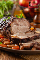 Whole roasted pork neck, stewed in wine with vegetables.