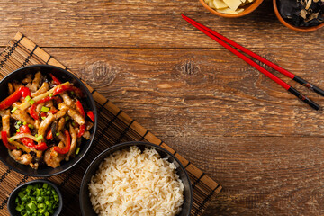 Pork chop with peppers, mushrooms and bamboo. Served with rice.