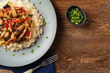 Pork chop with peppers, mushrooms and bamboo. Served with rice.