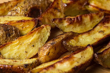 Rustic fried potatoes in full screen. Fried food as a background