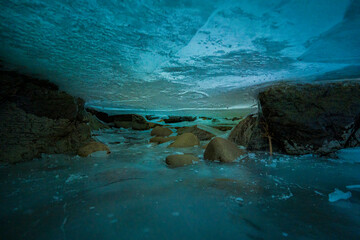 shot between layers of ice of frozen river