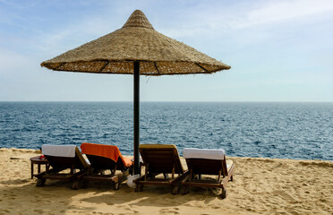 reed beach umbrella on the background of the sea in Egypt