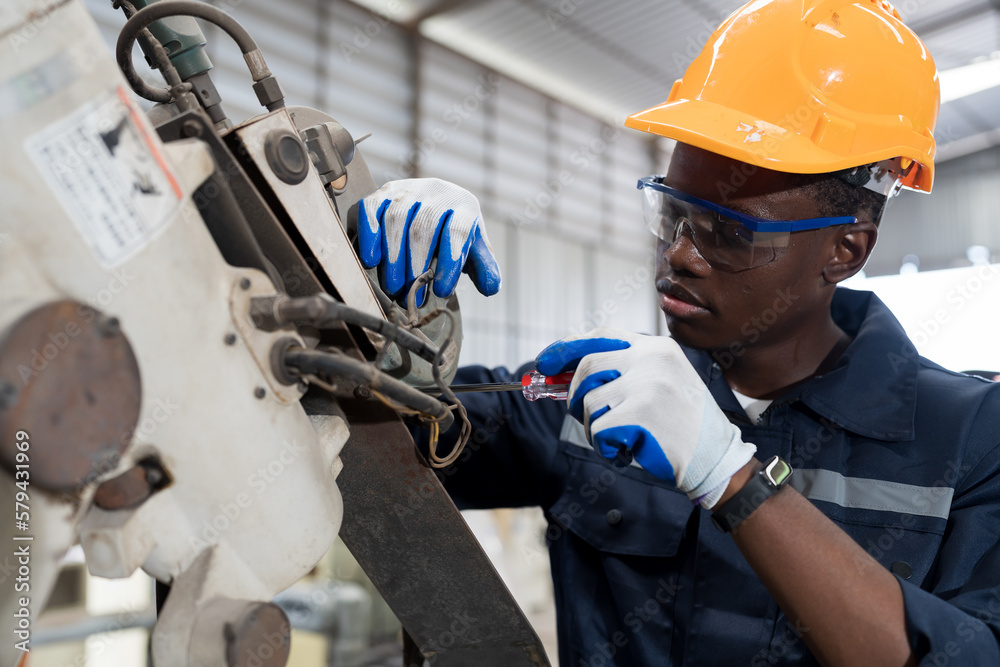 Leinwandbilder technician repair robotic arm in workshop. engineer maintenance automatic robotic arm machines in fa