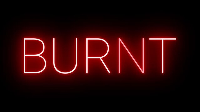 Bright neon glowing red sign illuminated on black background