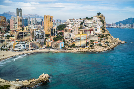 Benidorm tourist town. apartment buildings, hotels on La Cala de Finestrat. Panorama of the densely built-up city with mountains in the background