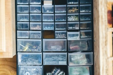 Variety of bolts, nuts, screws, and staples in a construction trailer
