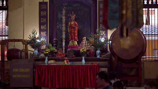 Footage of an altar with a deity statue at the Chua Quan Su Buddhist Temple in Hanoi, Vietnam