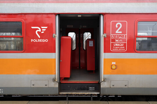 Open sliding doors of PKP class EN57 train, in service for Polregio Polish regional rail operator, at Skawina railway station platform on January 30, 2023 in Skawina, Poland.