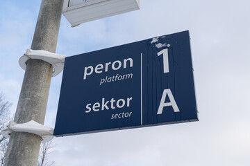 Blue railway station sign in Poland. Train platform number information. Peron in Polish language means platform, sektor means sector. - obrazy, fototapety, plakaty