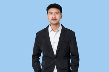 Portrait of Young handsome asian Business Person isolated on blue light background