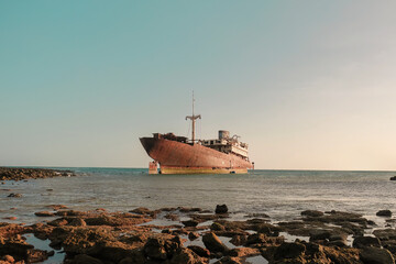 Abandoned old rusty ghost ship (Temple Hall) in 1977 due to a shipwreck near Arrecife, Lanzarote,...
