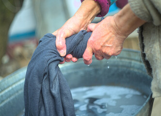 Woman wringing out clothes
