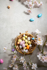 Small chocolate Easter eggs flowers holiday still life