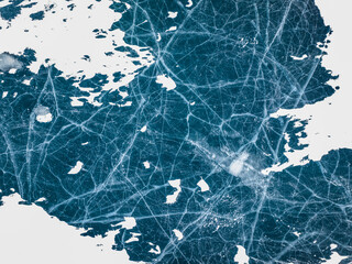 frozen lake with cracked ice, aerial view