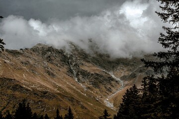 Aerial landscape of the rocky hill San Bernardino covered in dark clouds