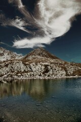 Vertical landscape of the beautiful rocky Nufenen mountain pass at the lake