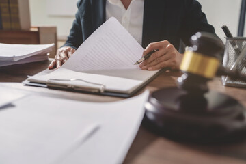 Justice lawyer considering a legal documents in courtroom..