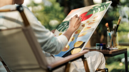 Female artist painting art canvas drawing with inspiration in garden art therapy creativity...