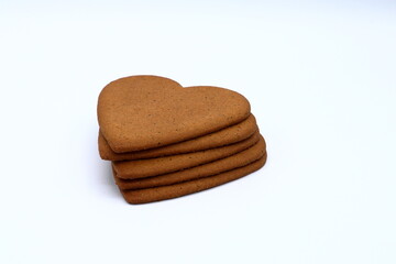 Heap of gingerbread hearts. White background. Stockholm, Sweden, 2023.
