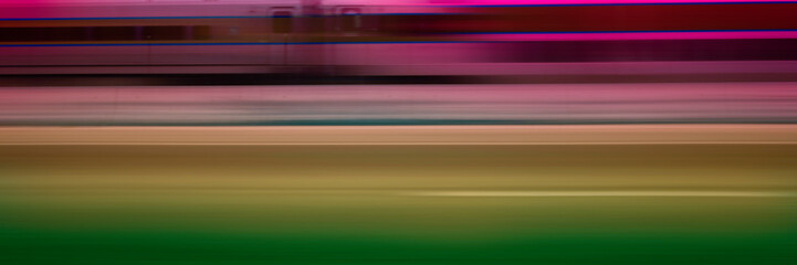 Motion blur commuter train passing on the road, abstract backgrounds for speed, road travel, or direction