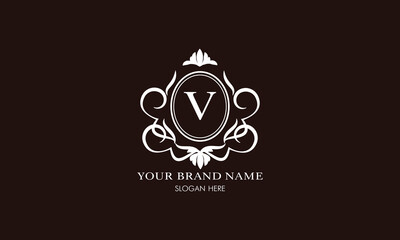 Vector illustration of letter V logo template. Classic floral monogram with decorative elements.