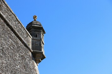 Low angle shot of a castle corner tower under the blue sky on a sunny day, Belle-Ile-en-Mer, France