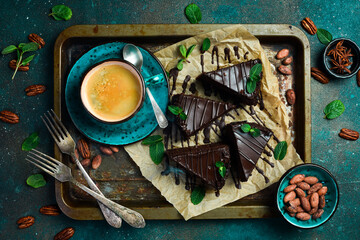 Fototapeta na wymiar Coffee and chocolate brownie. On a metal tray. Sweets Top view.
