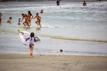 children running on the beach
