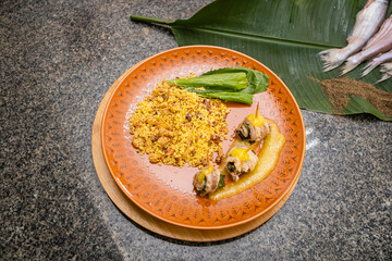 fried fish roll with banana and bacon farofa