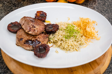 fillet with peach palm sauce and chicory rice