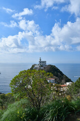 Fototapeta na wymiar The lighthouse of Capo Miseno, on the coast facing the islands of the gulf of Naples, Italy.