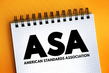 ASA - American Standards Association acronym text on notepad, abbreviation concept background