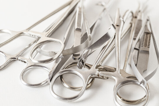 Surgical Metal Instruments, On White Background, Clamps, Tweezers, Scissors, Selective Focus