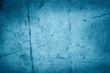 Abstract grunge decorative relief dark blue stucco wall texture.