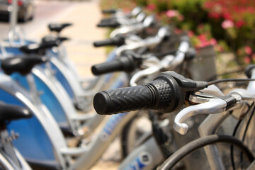 Row of rental city bikes at docking station in Dubai