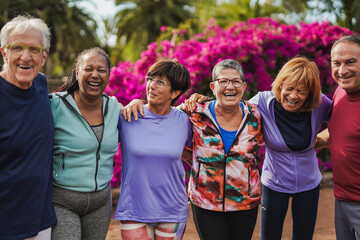Group of happy senior people having fun after yoga lesson at city park - Healthy lifestyle concept
