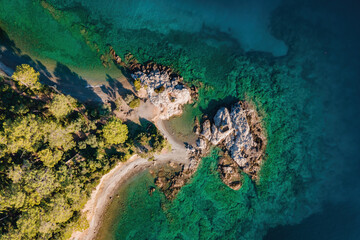 Fototapeta na wymiar Rocky shore of Aegean sea, aerial top down view