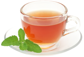 Herbal tea in a cup with tulsi leaves
