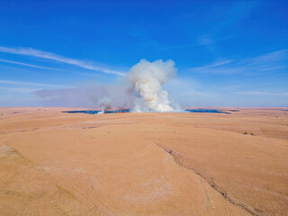 Aerial view of a wild fire burning on the ground