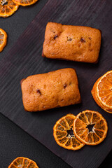 Delicious chocolate muffins and dried round shaped slices of tangerine