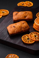 Delicious chocolate muffins and dried round shaped slices of tangerine