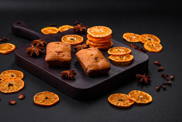 Delicious chocolate muffins and dried round shaped slices of tangerine