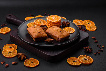 Delicious chocolate muffins and dried round shaped slices of tangerine