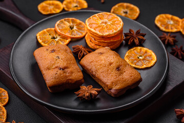 Delicious chocolate muffins and dried round shaped slices of tangerine