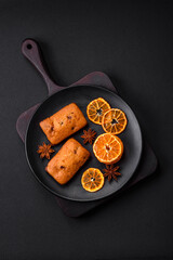 Delicious chocolate muffins and dried round shaped slices of tangerine