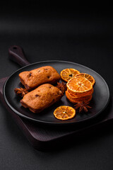 Delicious chocolate muffins and dried round shaped slices of tangerine